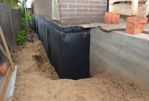 Happy homeowners after waterproofing job in Brookville